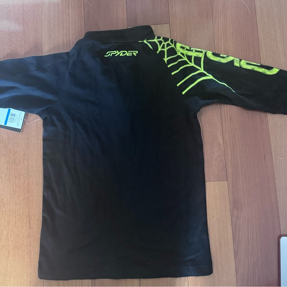 Boys  black Spyder athletic long sleeve top with bright green spider logo